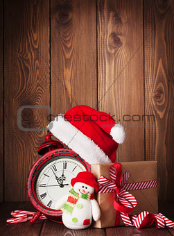 Christmas gift box, alarm clock and snowman toy