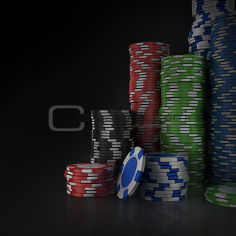 Stacks of poker chips on black background.