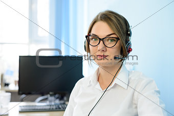 Young Attractive Smiling Customer Support Phone Operator with Headset in Office.