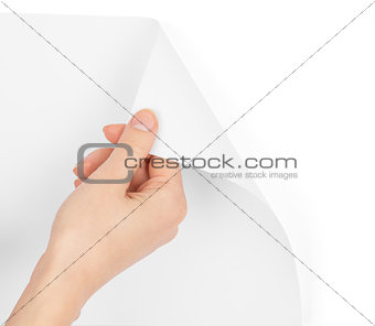 Humans hand turning blank page