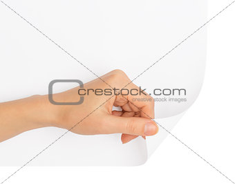 Humans hand turning blank page corner