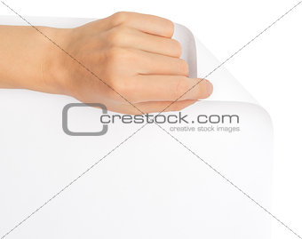 Womans hand turning blank page corner