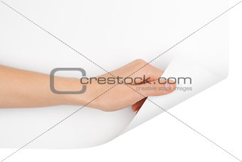 Humans hand turning bottom blank page corner