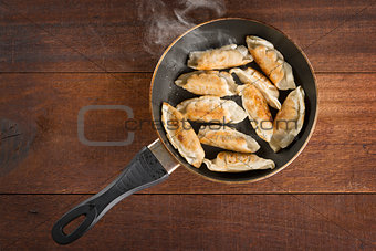 Asian food fried dumpling in cooking pan