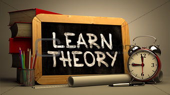 Learn TheoryHandwritten by white Chalk on a Blackboard.