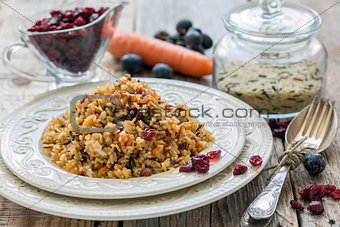 Pilaf with raisins, carrots and cranberries.