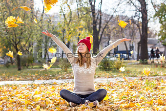 Happy woman with colorful leaves