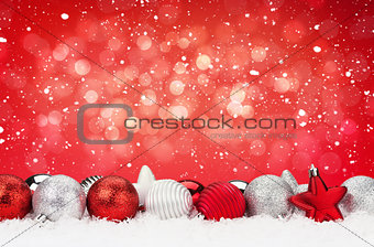 Christmas background with baubles and snow