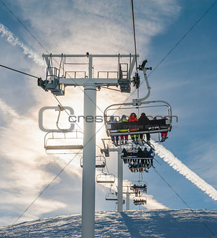 Ski chairlift going over a mountain