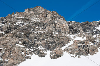 Rocky alpine mountainside in winter