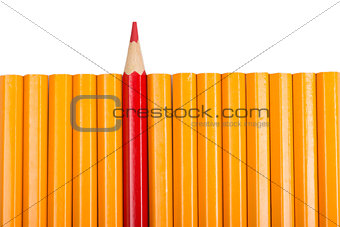 Red sharpened pencil among non sharpened yellow