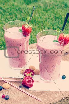 Fruity berry milkshake outdoors