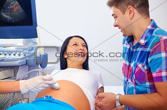 happy couple on ultrasound, determines the gender of child