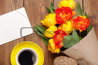 Colorful tulips, greeting card and coffee