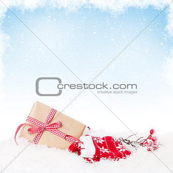 Christmas gift box in snow