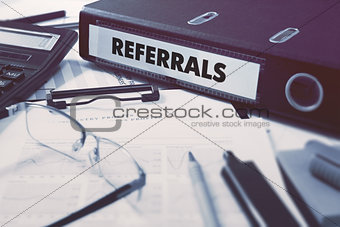 Referrals on Ring Binder. Blured, Toned Image.