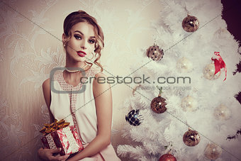 elegant girl near christmas tree