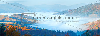 Autumn misty morning mountain panorama