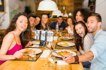 Friends at the restaurant making a selfie
