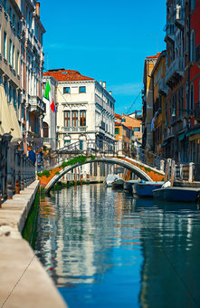 Bridge over channel among houses in Venice