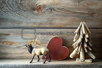 Christmas tree decorations on wooden shelf