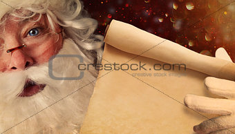 Closeup of Santa Claus holding a Santa List 