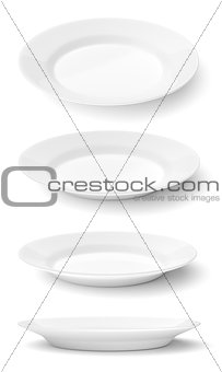 Empty ceramic round plates isolated on white 