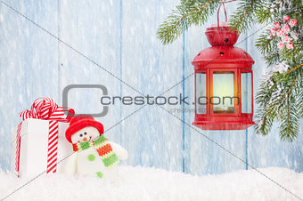 Christmas candle lantern, gift box and snowman