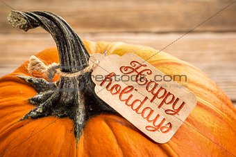 Happy holidays price tag on pumpkin