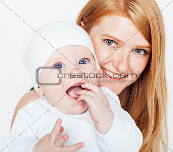 young beauty mother with baby, red head happy family isolated