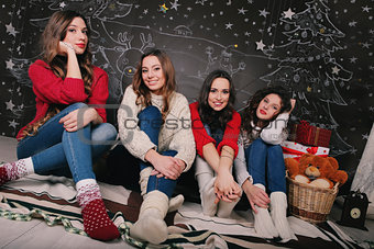 Four girlfriend on a beautiful New Year's background