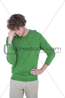 Sad casual man standing in front of camera
