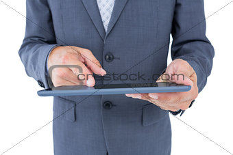 Close up view of businessman using tablet computer