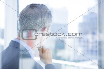 Thinking businessman in the office