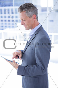 Businessman holding a tablet