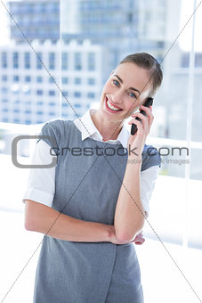 Smiling businessmwomen talking on the phone