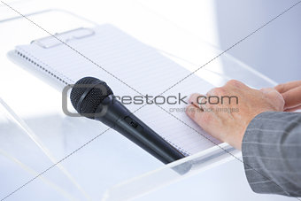 Businessman taking notes at conference