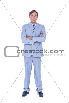 Portrait of a doubtful businessman with the arms crossed