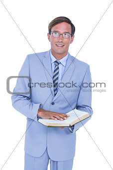 businessman holding a book