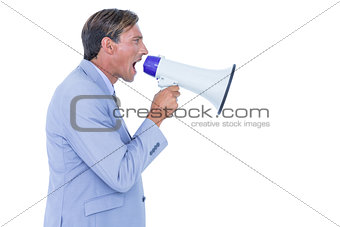 Businessman talking through megaphone