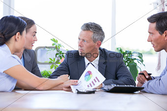 Businessman meeting with colleagues using laptop