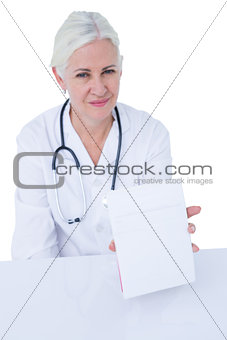Doctor writing on a notepad