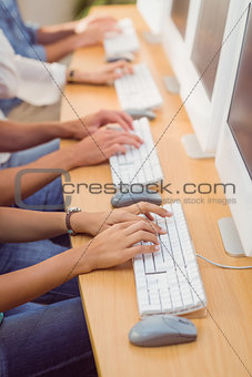 Business people typing on keyboard