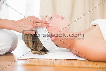 Beautiful blonde getting a head massage