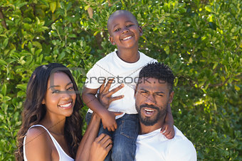Happy family smiling at camera