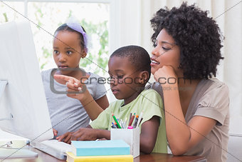 Happy family using the computer
