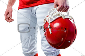 An american football player taking his helmet on her hand