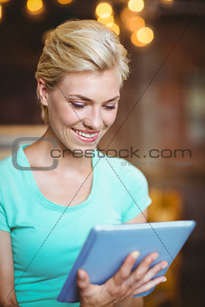 Pretty blonde using tablet computer