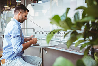 Businessman holding a cup of coffee