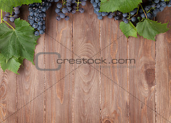 Red grape on wooden table